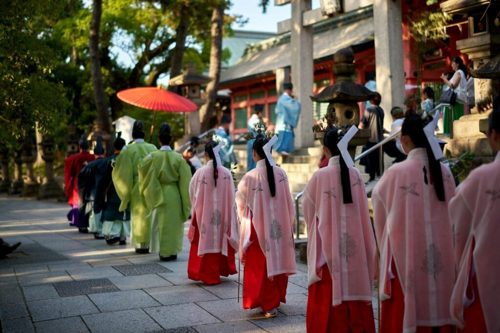 Top 8 Unforgettable Festivals in Osaka You Must Experience 3 a group of geisha walking down a street stockpack unsplash